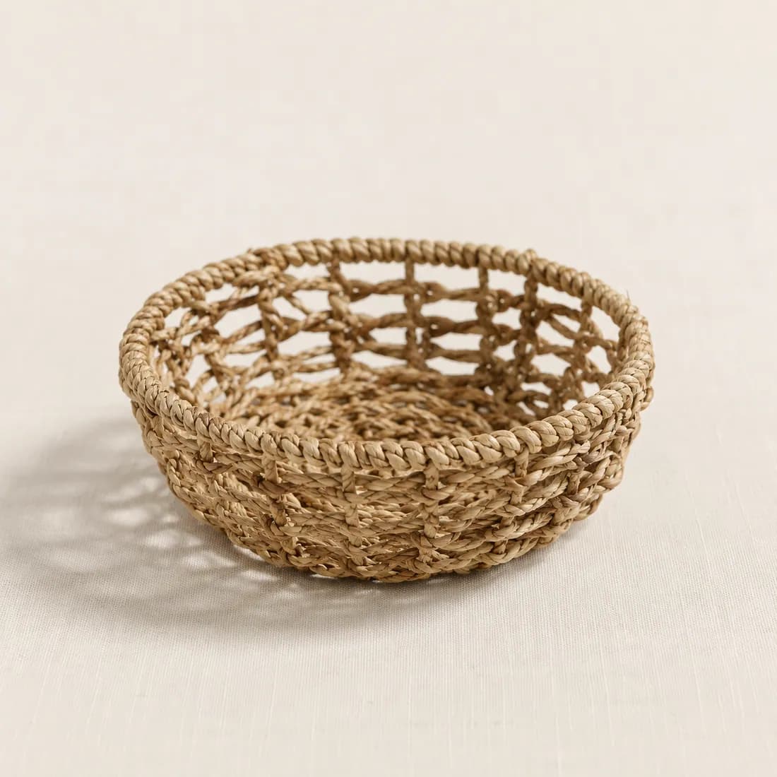 Bathroom Basket Ø18 — Seagrass — Seagrass weave, shown empty on a plain background