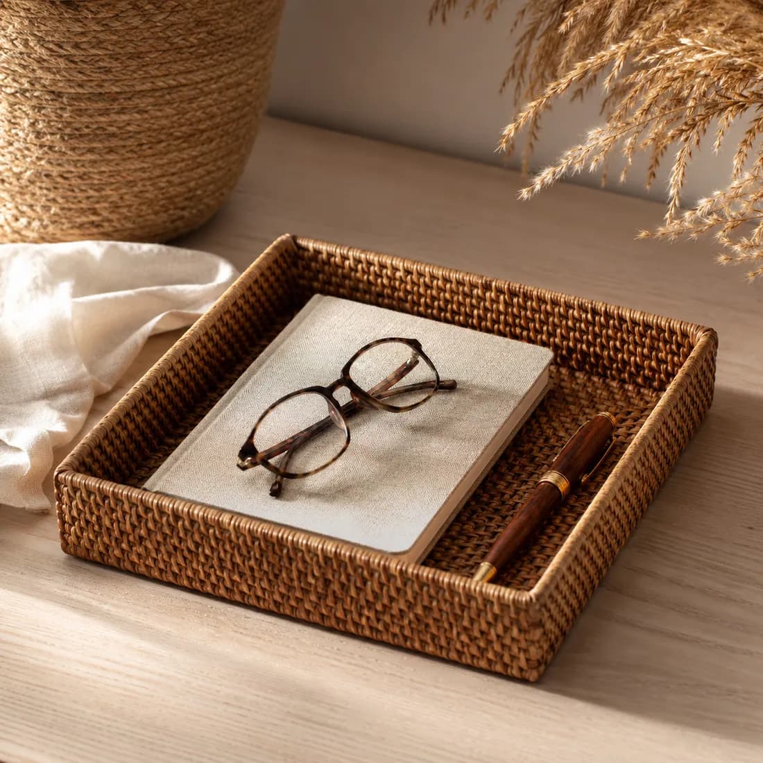 Desk Tray Woven 25×18 — Raffia in use, loaded, photographed in a room