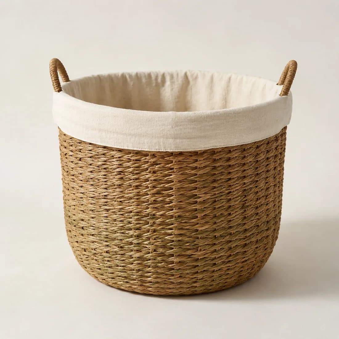 Laundry Basket with Liner — Seagrass & Cotton — Seagrass weave, shown empty on a plain background