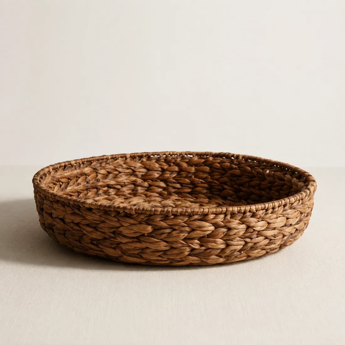 Low Basket Ø38 — Water Hyacinth — Water hyacinth weave, shown empty on a plain background